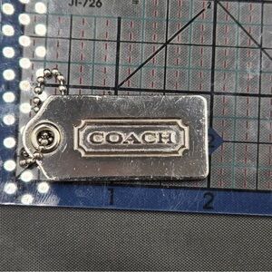 Coach Metallic Silver Tag Keychain